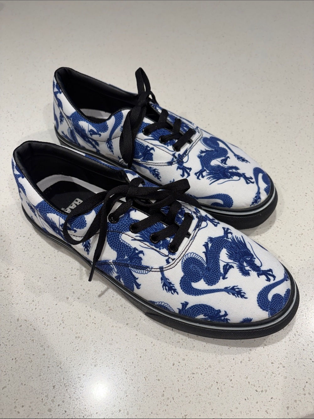RAAD Shop - Japanese Dragons in Navy Blue on a White background.  Black leathers